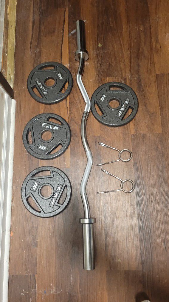 Curl. Bar And Weights 