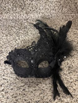 Black lace masquerade mask with feathers