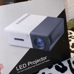 Compact White and Gray LED Mini Projector