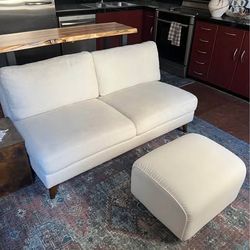 Cream loveseat and ottoman