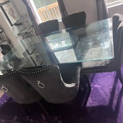 ELEGANT ORNATE BLACK BASE GLASS TABLE TOP DINING SET WITH 6 CHAIRS