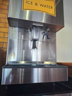 Ice and water restauran machine. Doesn't make ice but can hold 40 gallons of ice. Contacts to water line. DONE NOT MAKE ICE