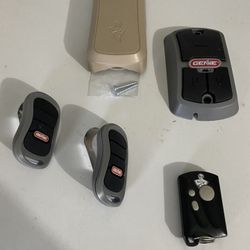 Genie Garage Door Car Remotes(2), Keychain Remote(1), Wall Button(1), Key Pad (1).
