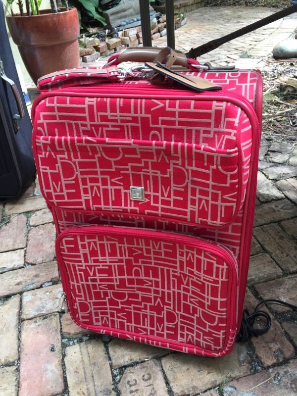 DVF luggage with various compartments.