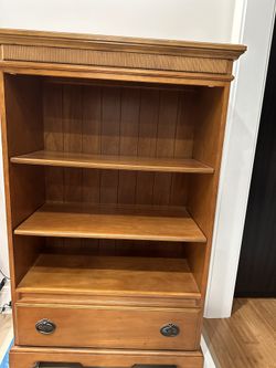 Broyhill wooden bookshelf with drawe.