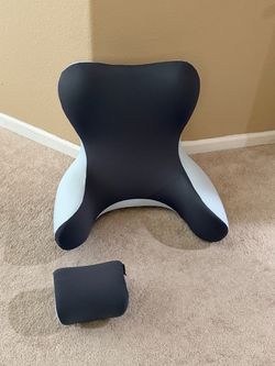 Support pillow sitting in bed
