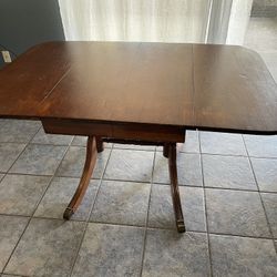 Wood Dining Table With Extra Leaf And Fold Down Sides 
