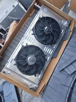 BRAND NEW ALUMINUM RADIATOR WITH FAN N SHROUT!! 150$