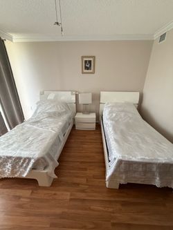 Like new barely used - 2 twin beds, mattress, and matching bedside cabinet