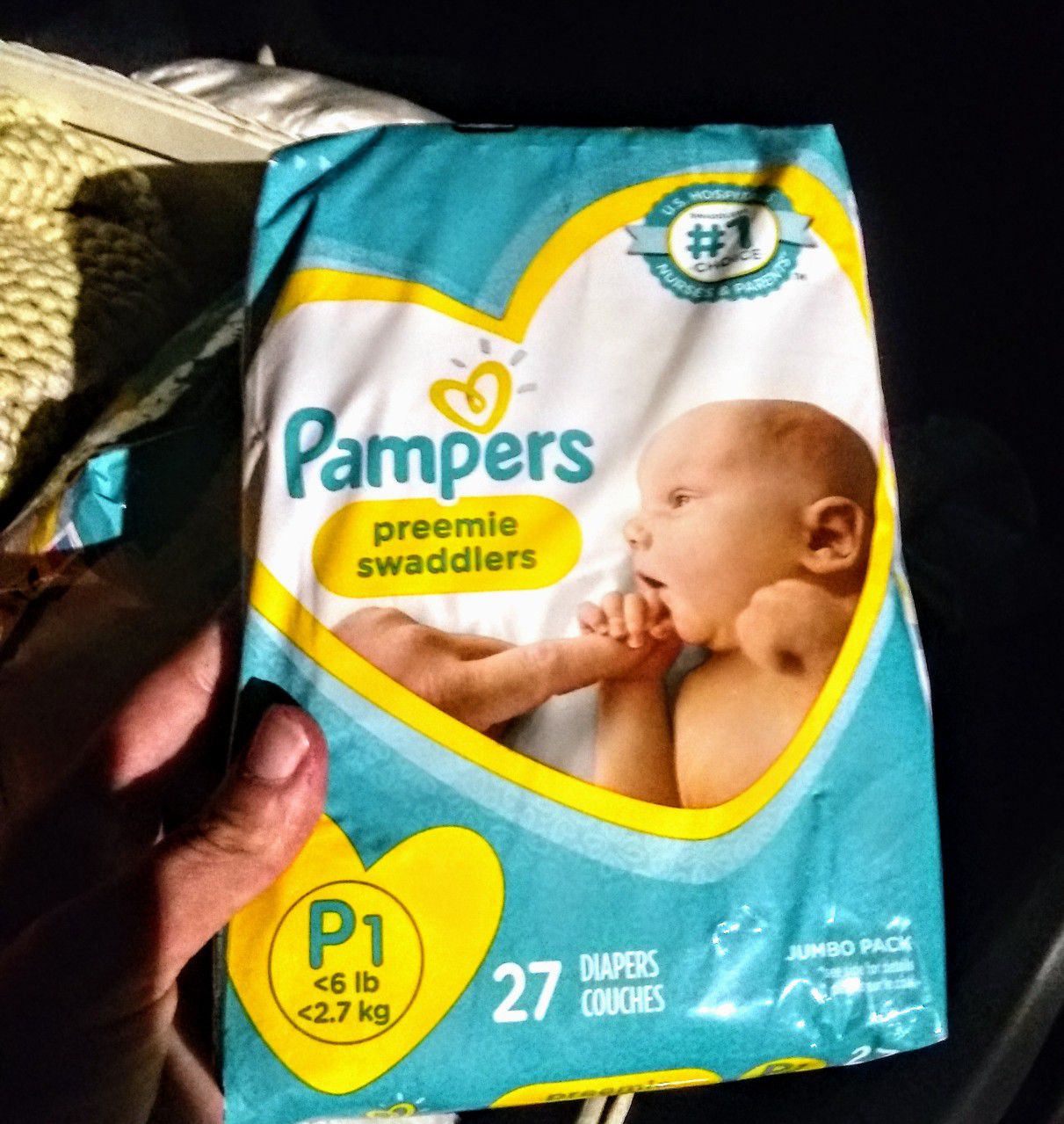 7 PACKS OF PAMPERS PREEMIE SWADDLERS BABY DIAPERS, ALSO a LARGE SIZE BAG SIZE OF PREEMIE DIAPERS. ESTIMATED 50+.