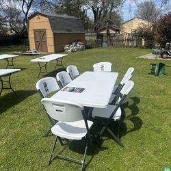 White foldable white chairs and table