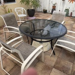 Glass Table And 4 Aluminum Chairs 