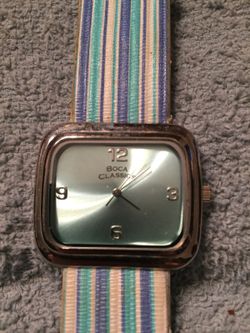 Nova Classics silver tone watch with striped leather band
