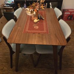 Cute Brown Dining Table And Light Blue Chairs