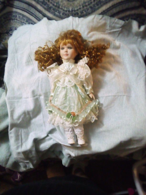 Porcelain Doll Long reddish long Curly Hair.