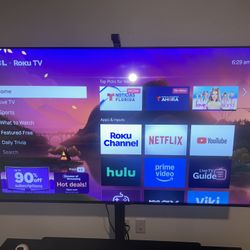 65” TCL Roku TV with Remote And Tv Stand For Table/furniture Top. Adjustable And Left/Right Swivel 