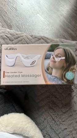 Heated under eye massager
