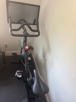 Peloton Indoor Exercise Bike with Touchscreen, Resistance Knob & SPD Pedals