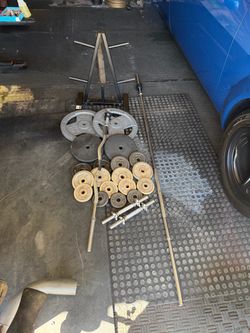 Standard weight plates 200lbs with 7ft straight bar plus curl bar and dumbbell handles and weight tree