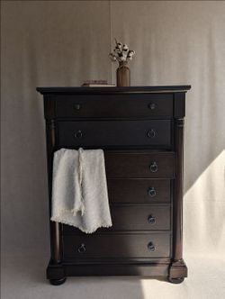 Tall ebony dresser