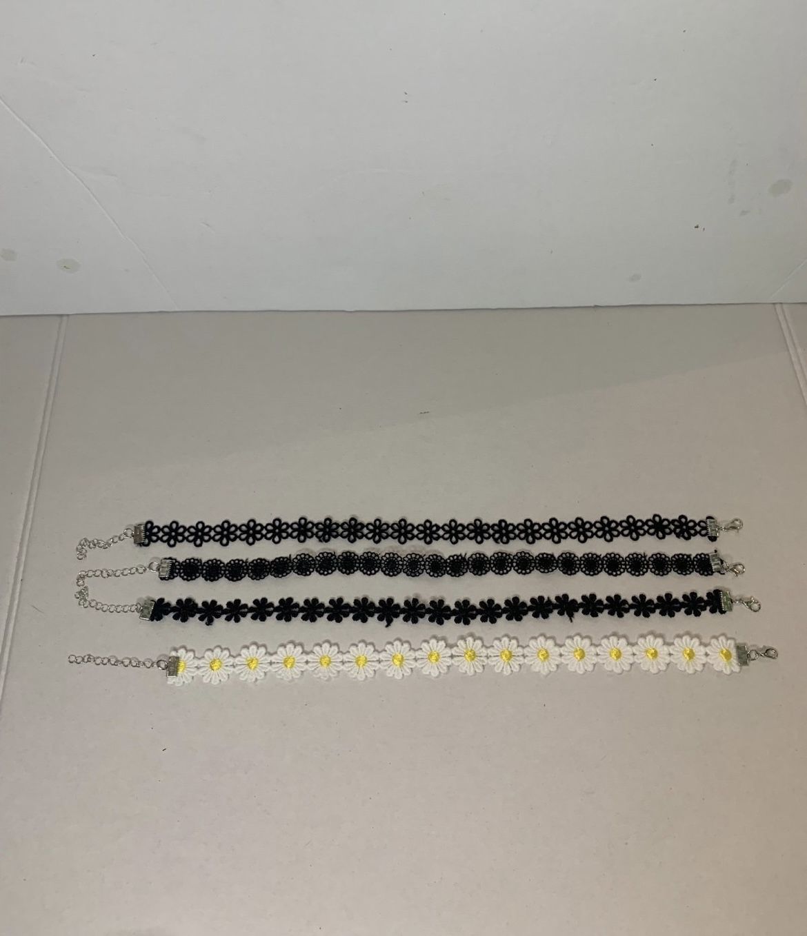Black velvet chokers and daisy choker 4 pack. (H)