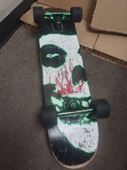 Complete Skateboard with Skull Graphic