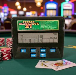Radica Model 1350 Pocket Blackjack 21 Electronic Handheld Travel Game WORKING Vintage. Rules & Scoring Chart. The green prize matrix printed on the fr