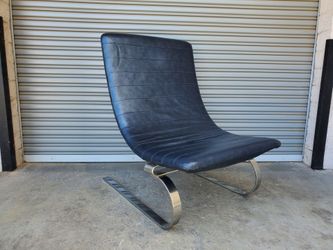 Leather and chrome Eames style chair