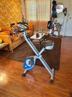 Xterra Exercise Bike Indoor Folding Stationary Bicycle, Folds Flat With Wheels, Compact Small Apartment