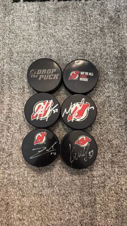 Signed New Jersey Devils Pucks