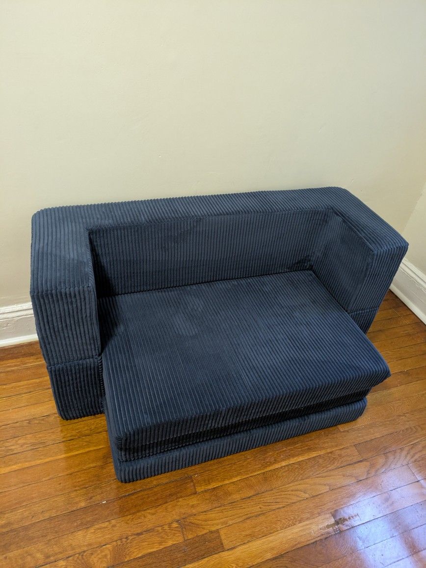 Navy blue velvety sofa bed