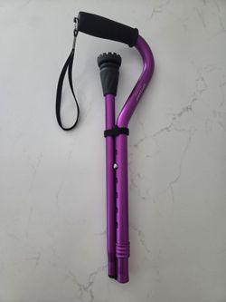 The GPTCAMP Folding Quad Cane is a purple, lightweight (1.1 lb) mobility aid featuring an offset EVA foam grip