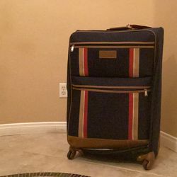 Navy Tommy Hilfiger Scout 5.0 softside expandable spinner suitcase.