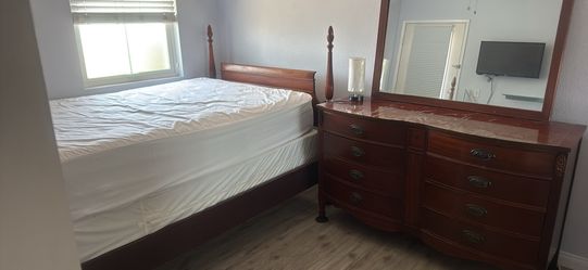 Antique bed frame and dresser with mirror