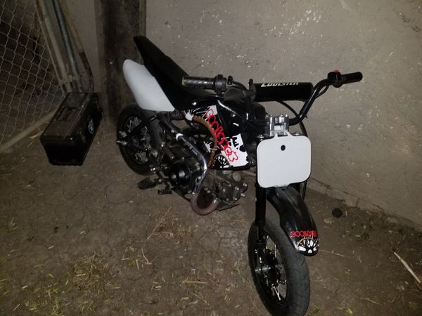(2014)70cc dirtbike (pink in hand) 700$ willing to trade for another dirt bike for Sale in ...