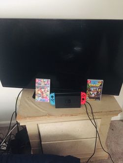 32 inch Vizio and Nintendo switch with Crash Bandacoot and Mario Kart