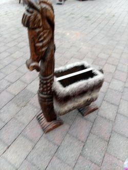 Carved Wooden Horse Figure with Fur Basket