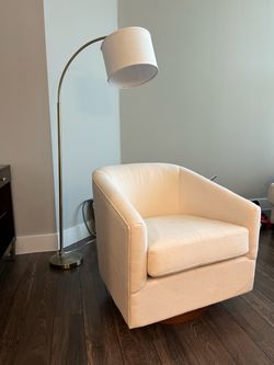 White armchair and floor lamp