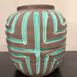 One of a kind vase in brown accented with teal.  7” tall 3 1/4” opening