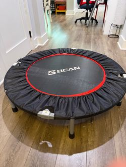 40 inch Black and grey BCAN mini trampoline with a handle bar.
