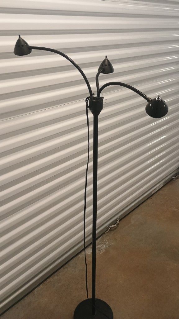 trio- black floor lamp- 67i inch tall- all three work independently.