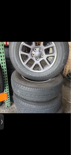 Jeep wrangler 18 inch rims and tires 255/7018 Bridgestone