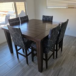 Dark wood table with 6 chairs