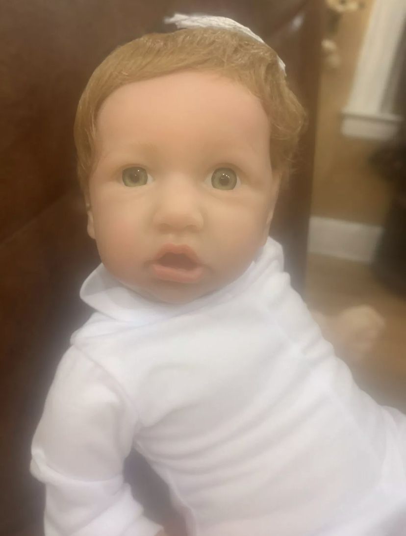 Reborn doll with green eyes 22 inches
