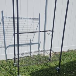 LARGE METAL SHELVES. ON WHEELS 6FT BY 3FT