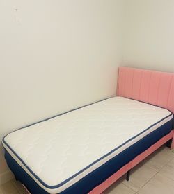 New Twin sized bed in pink. Includes Mattress that is in new condition. $160 for both
