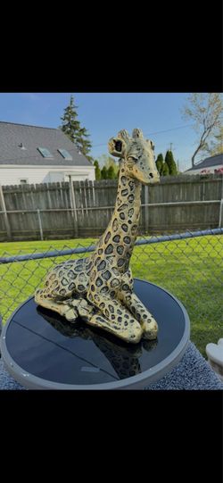 Golden giraffe statue