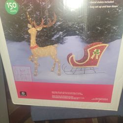 Glittering deer and sleigh