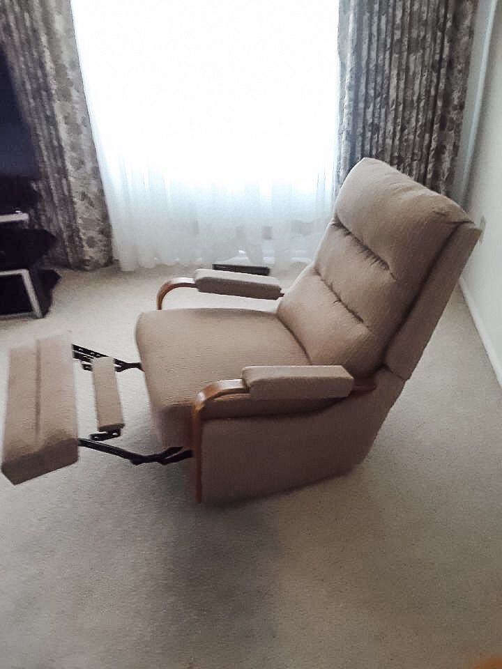 Tan upholstered recliner chair, very good condition, living room furniture, reclining chair.