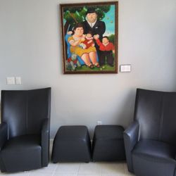 Italian Designed Leather Chairs With Two Ottomans.